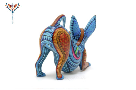 Alebrije - xoloitzcuintle estirándose - Arte Huichol - Marakame